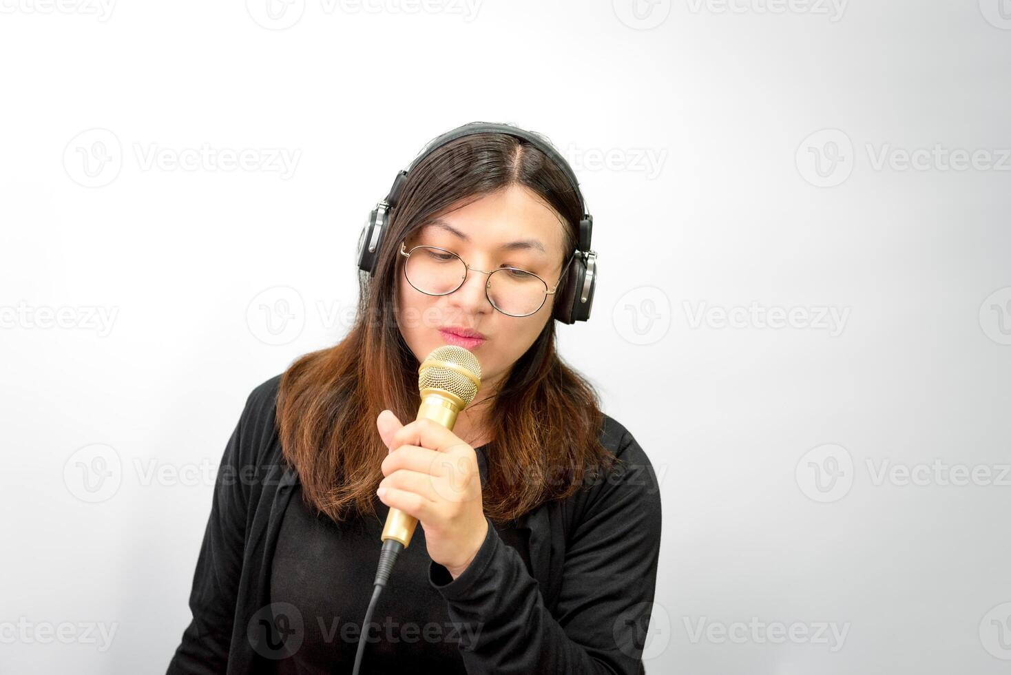 A woman with headphones and a microphone photo