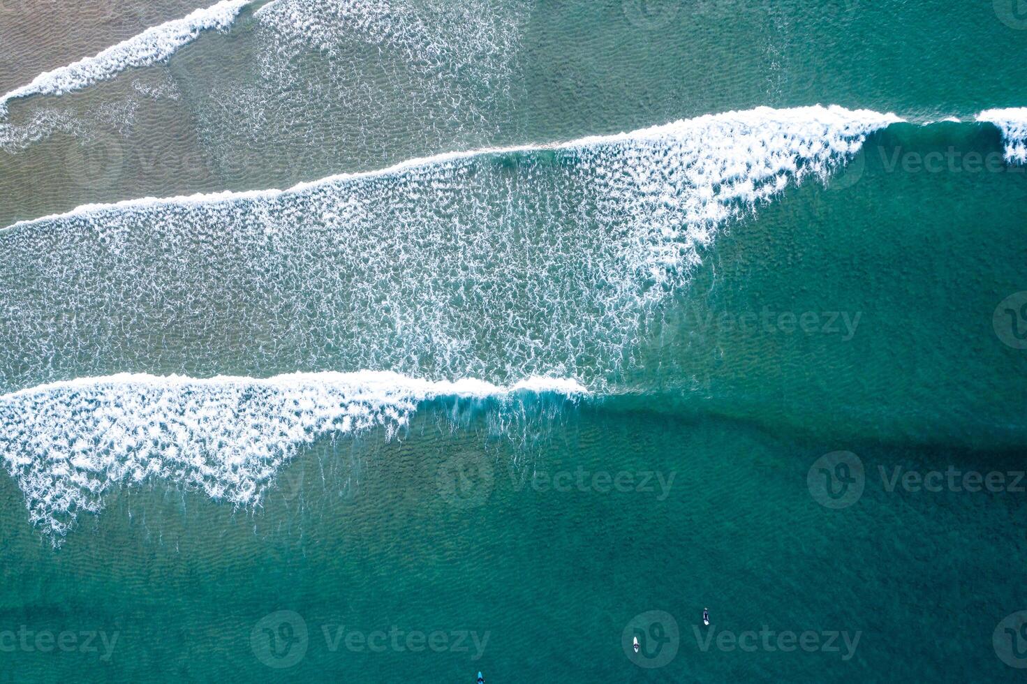 Atlantic Ocean Surf Session Seen from a Drone, Aerial drone top down View of Turquoise Ocean Waves Crashing photo