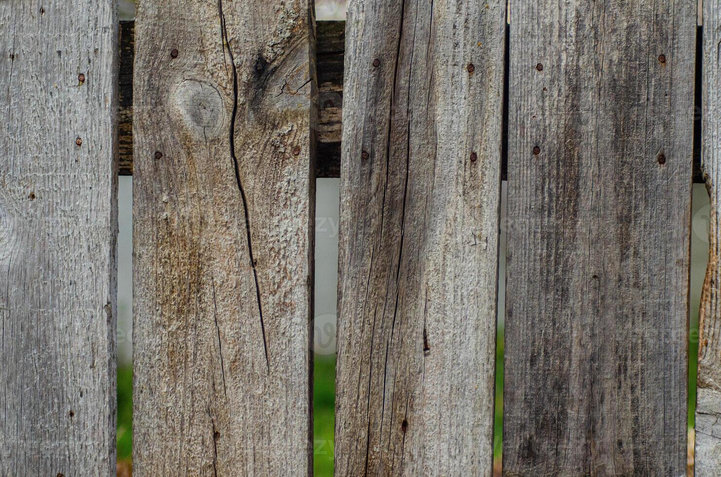 detail of aged wooden fence surface texture photo