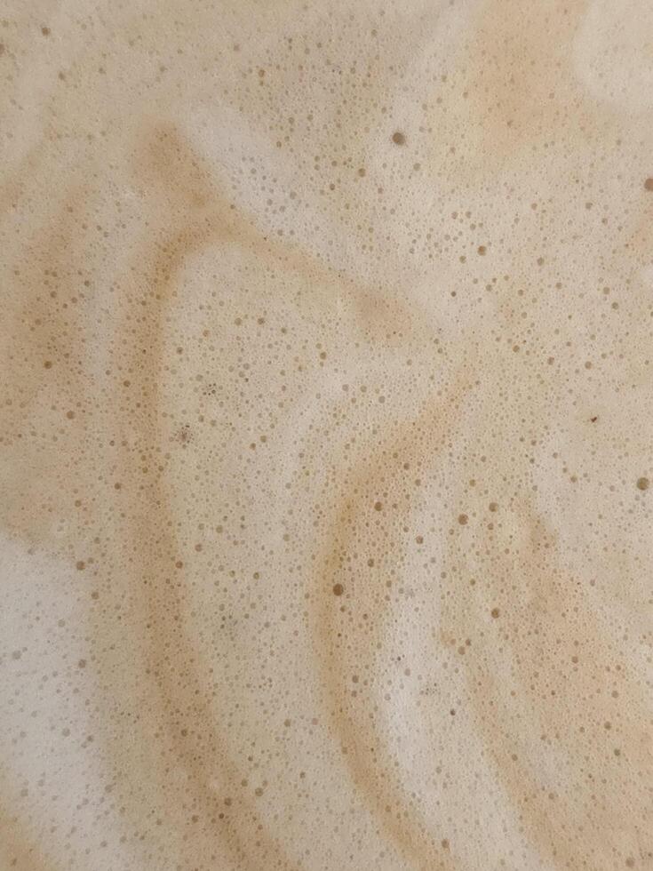 Coffee foam for background. Coffee foam texture... photo