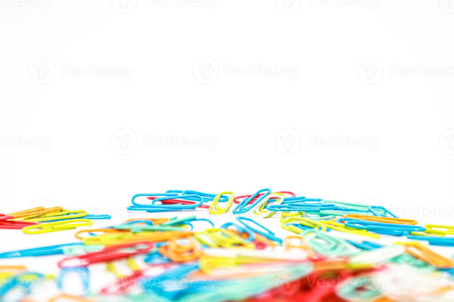 Colorful Array of Paper Clips Isolated on White Background for Office or School Supplies photo