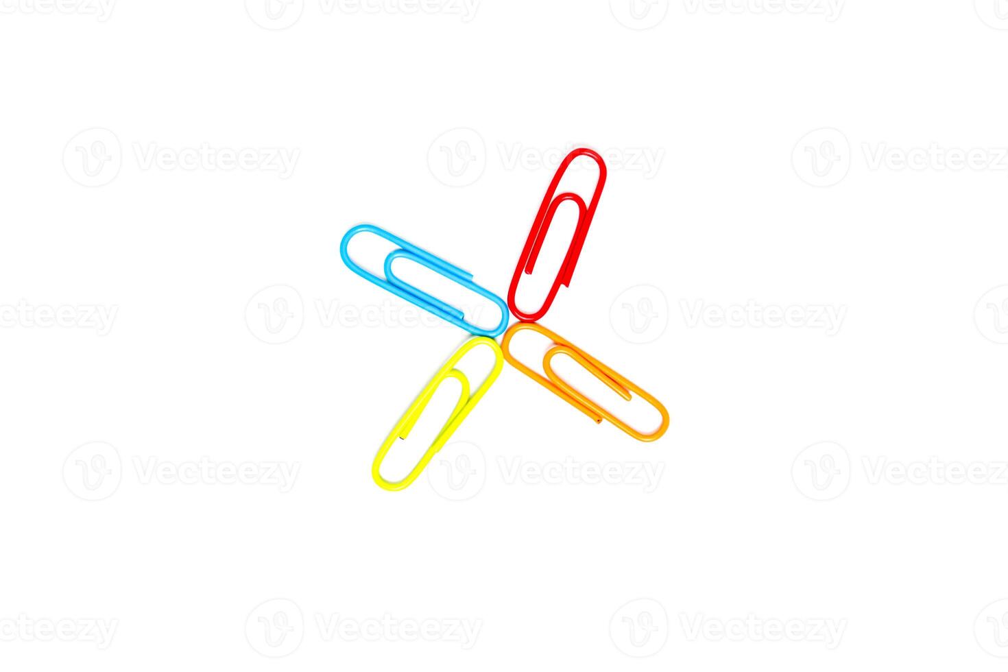 Colorful Paper Clips Arranged in a Star Pattern on a Clean White Background for Office or Educational Supplies photo