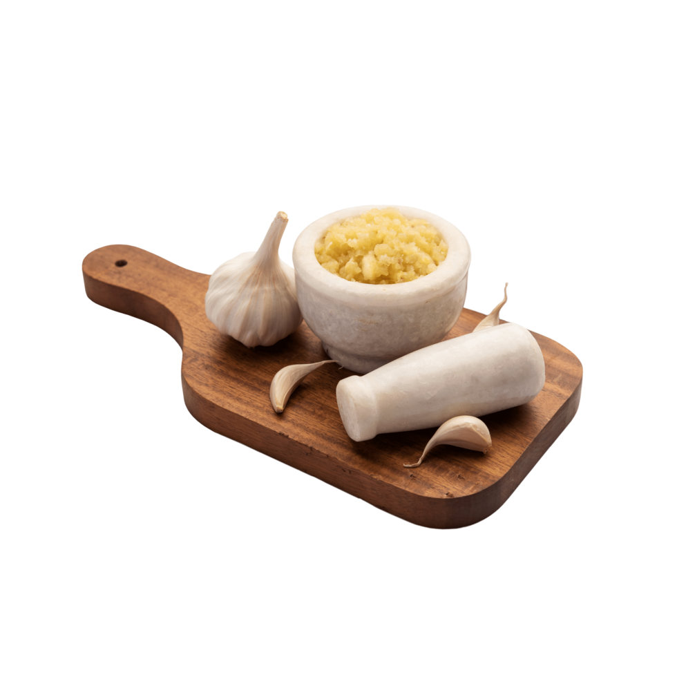 Minced garlic paste or lahsun puree on a wooden chop board png