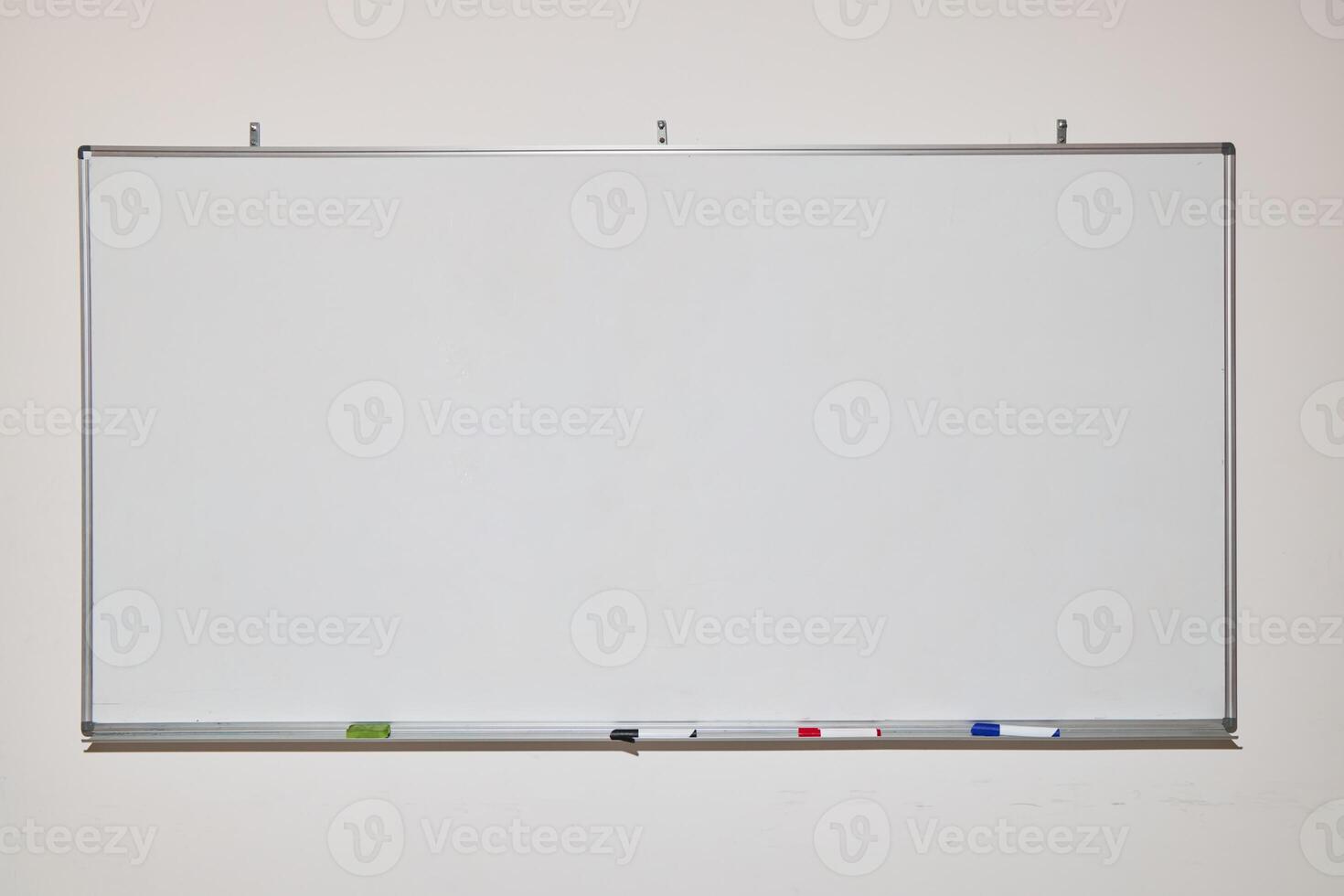 A Blank Whiteboard Set Up and Ready for Ideas, Collaboration, and Creative Thinking photo