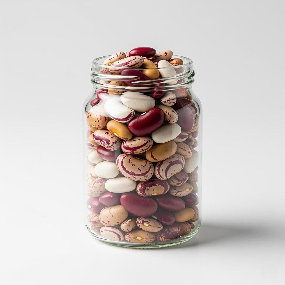 A jar filled with beans and nuts photo