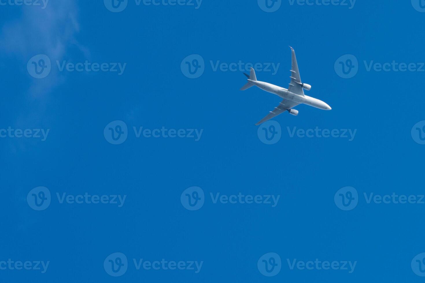 The commercial plane is flying in the sky. photo