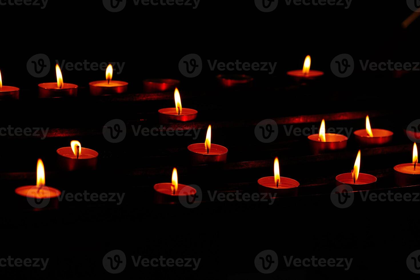 Serene candlelight arrangement in darkness photo