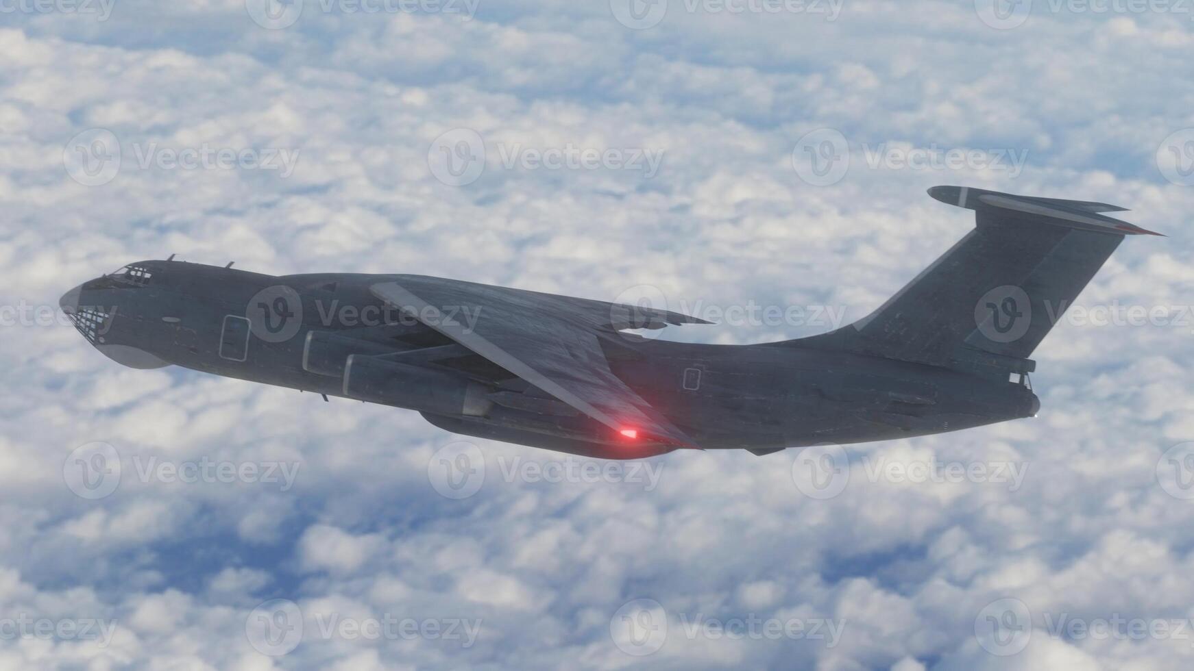 A military plane flying through the sky with clouds in the background photo