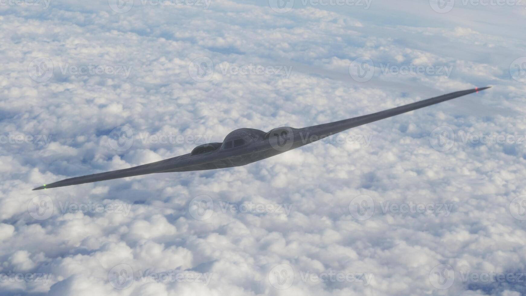 A stealth fighter flying through the clouds photo
