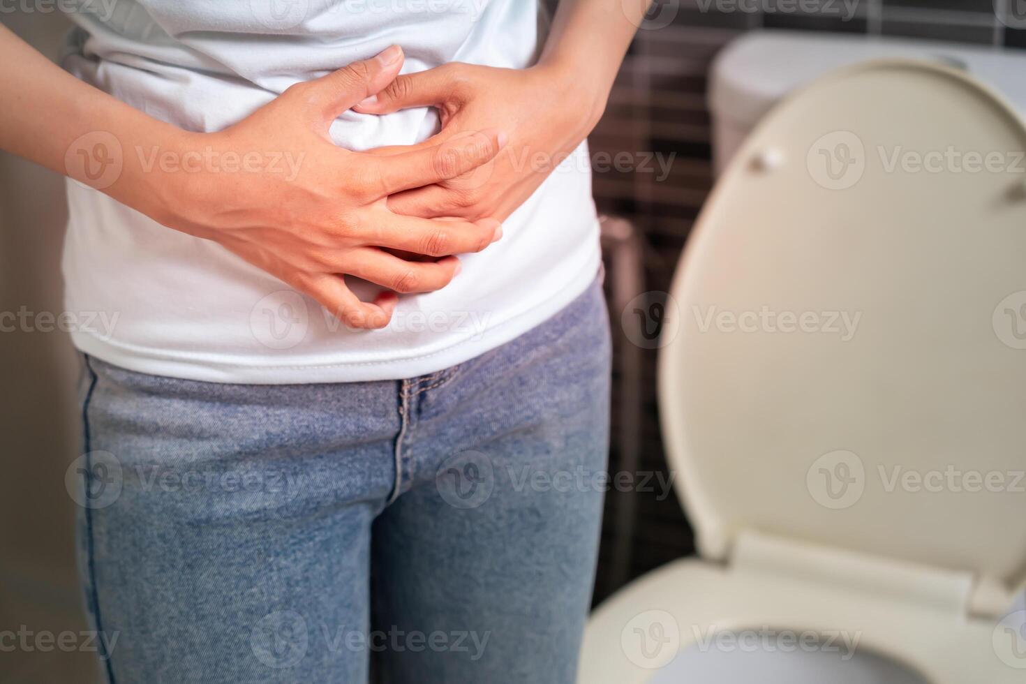 Constipation and diarrhea in bathroom. Hurt woman touch belly stomach ache painful. colon inflammation problem, toxic food, abdominal pain, abdomen, constipated in toilet stomachache, Hygiene. photo