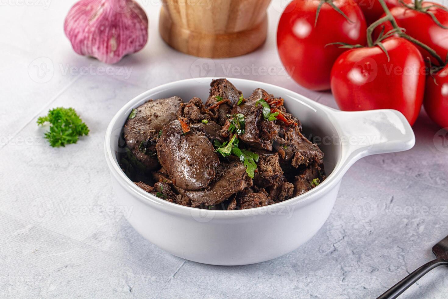 A bowl of beef with vegetables and garlic photo