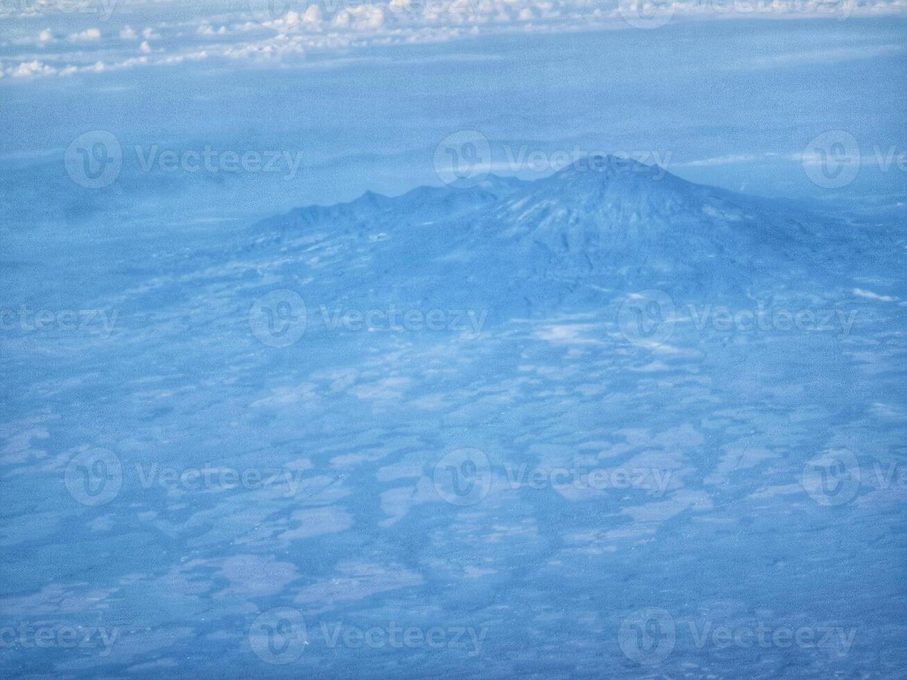 Aerial View of Mountain Landscape with Blue Tones and Cloudscape Scenery photo