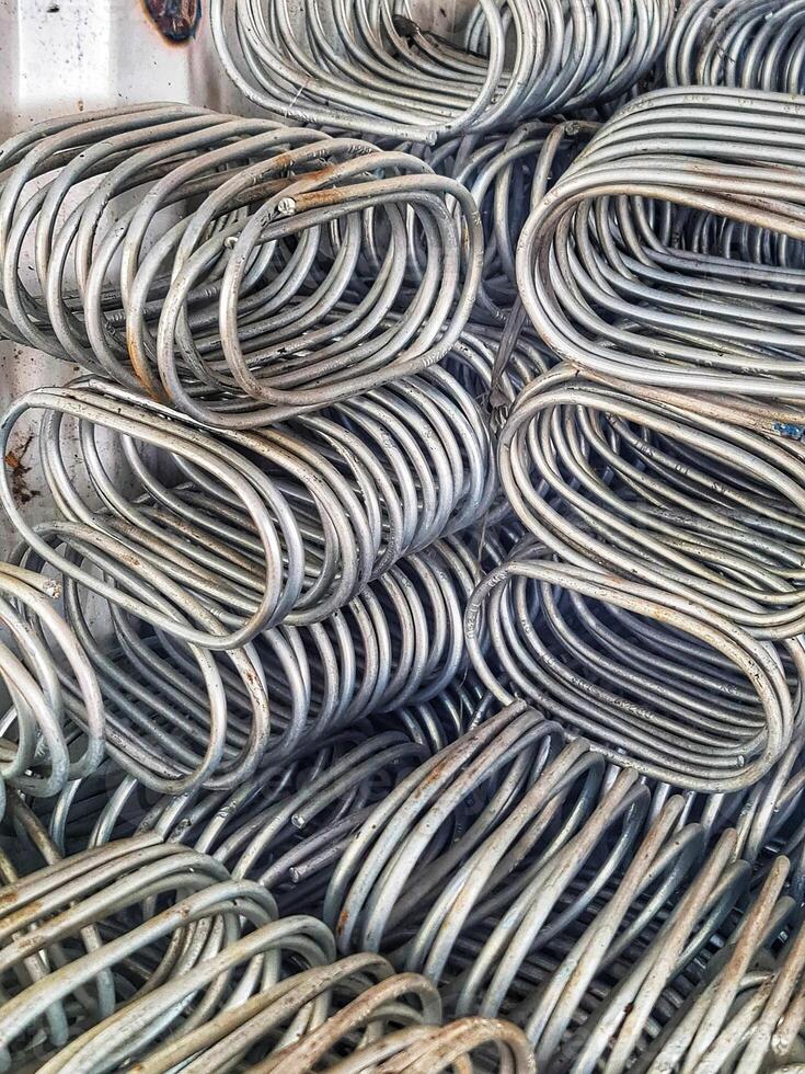 Metal Rods Stacked in Oval Shapes Industrial Abstract photo