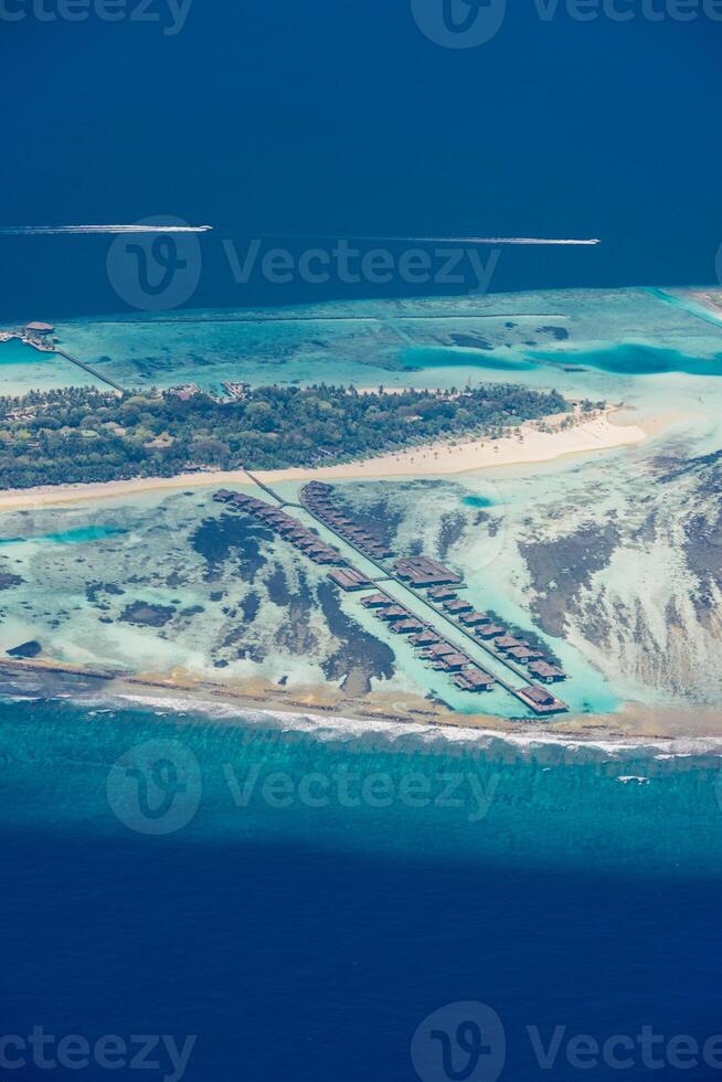 Spectacular Maldives aerial luxury water villas crystal-clear lagoon vibrant coral reef tropical island paradise perfect summer vacation exotic travel unforgettable beach getaway photo
