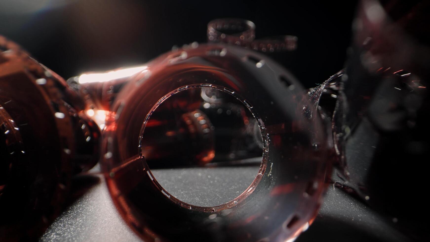 An old twisted color film lies on a dark background, symbolizing memories on the film. The film appears aged with faded colors and curled edges, evoking nostalgia. photo