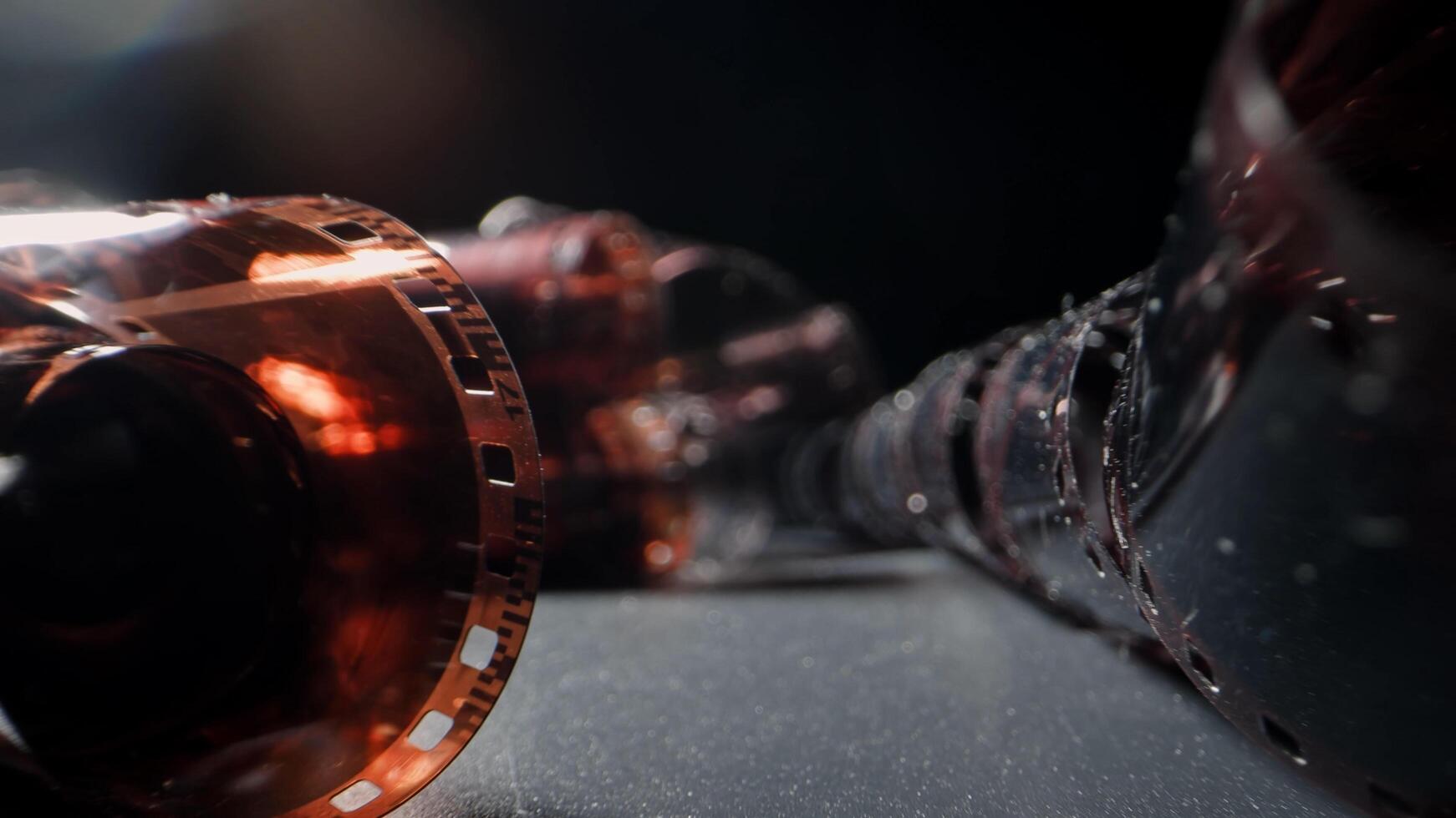 The film creates a vintage and nostalgic feel. Close-up of a roll of film showing the perforated edges and smooth surface photo