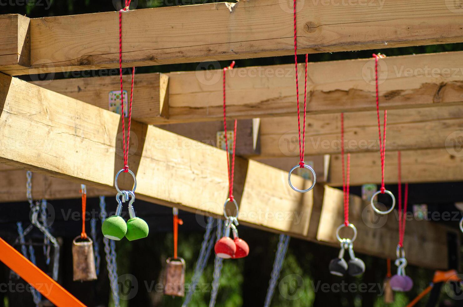 a challenging obstacle course rig with various hanging grips and rings photo