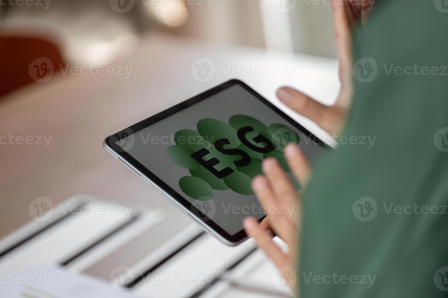 ESG sustainability focus with digital tablet displaying ESG concept photo