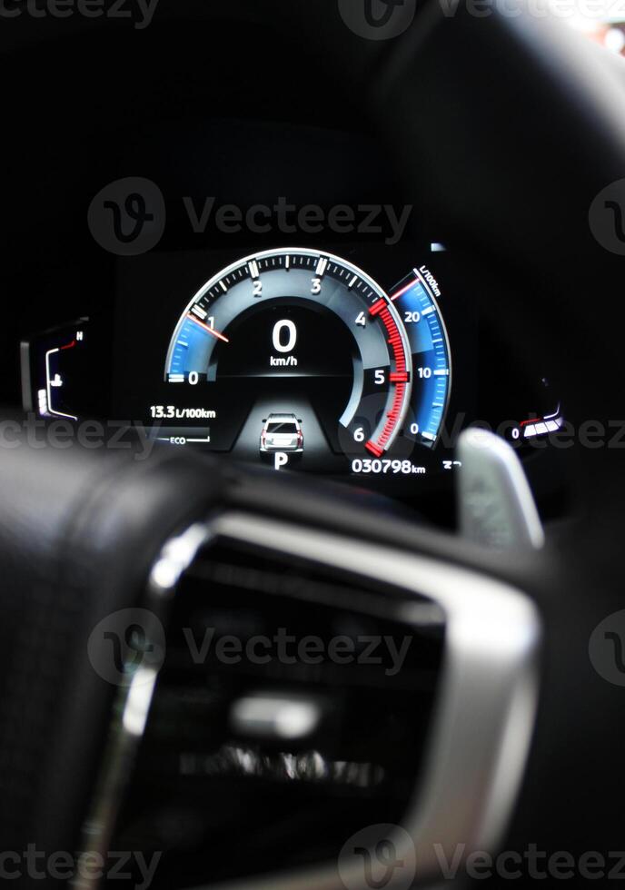 Modern digital screen panel of a car with indications of technical parameters photo