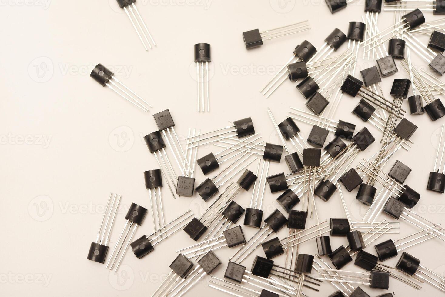 Assorted plastic bipolar transistors.A scattering of plastic transistors. A bipolar transistor for electronics. photo