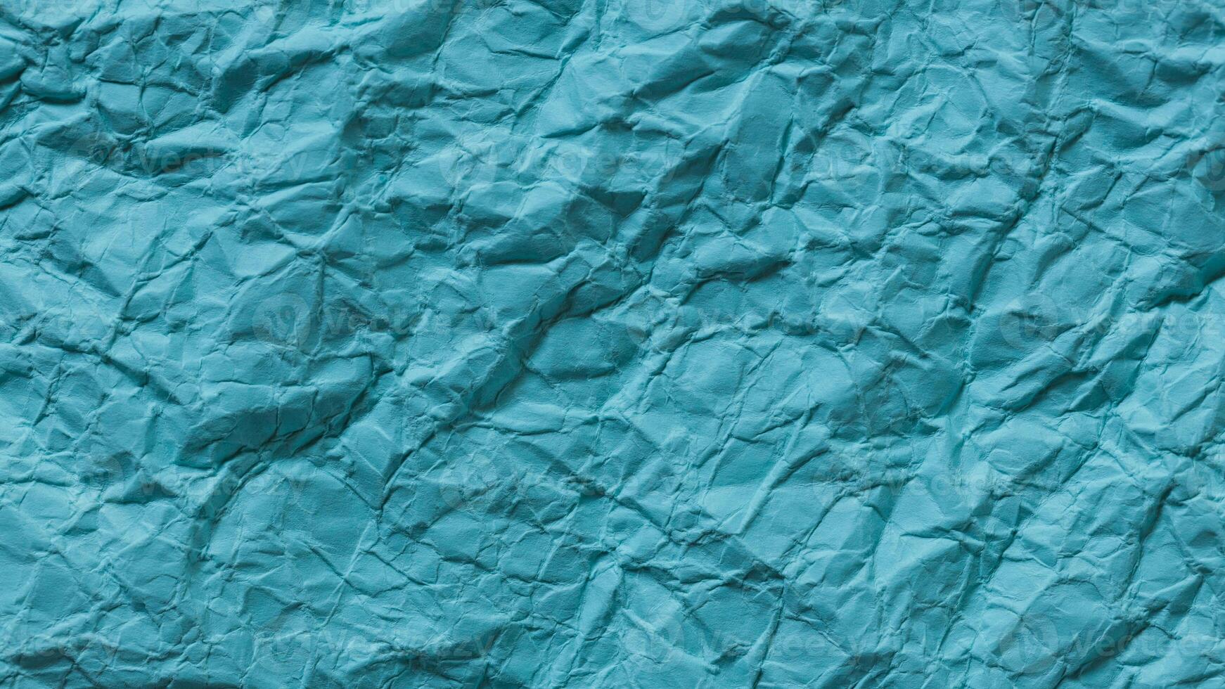 Crumpled Turquoise Paper Texture Background photo