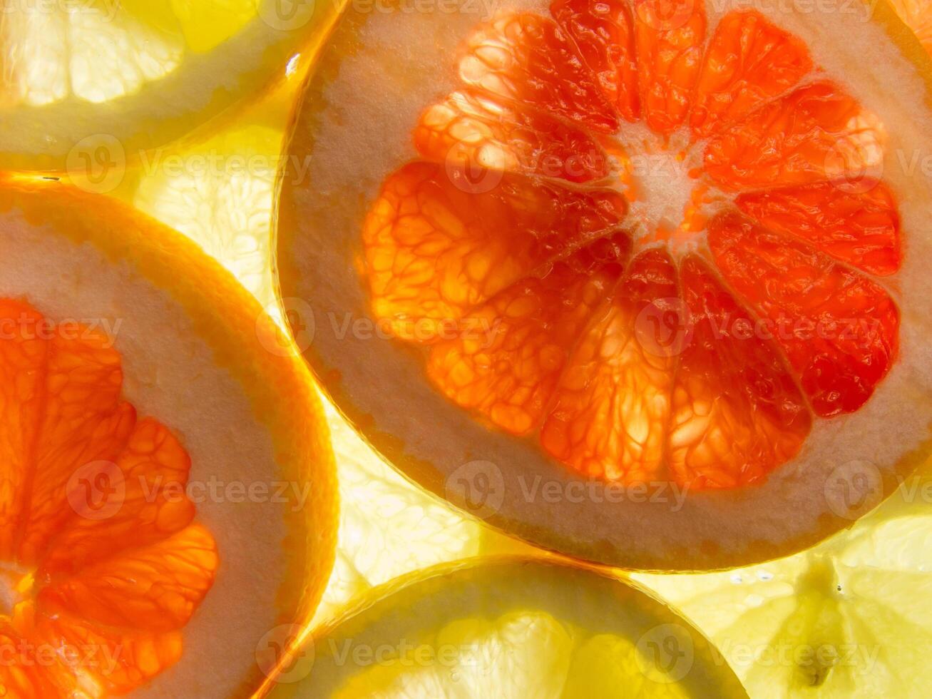 A close up of a bunch of oranges and lemons photo
