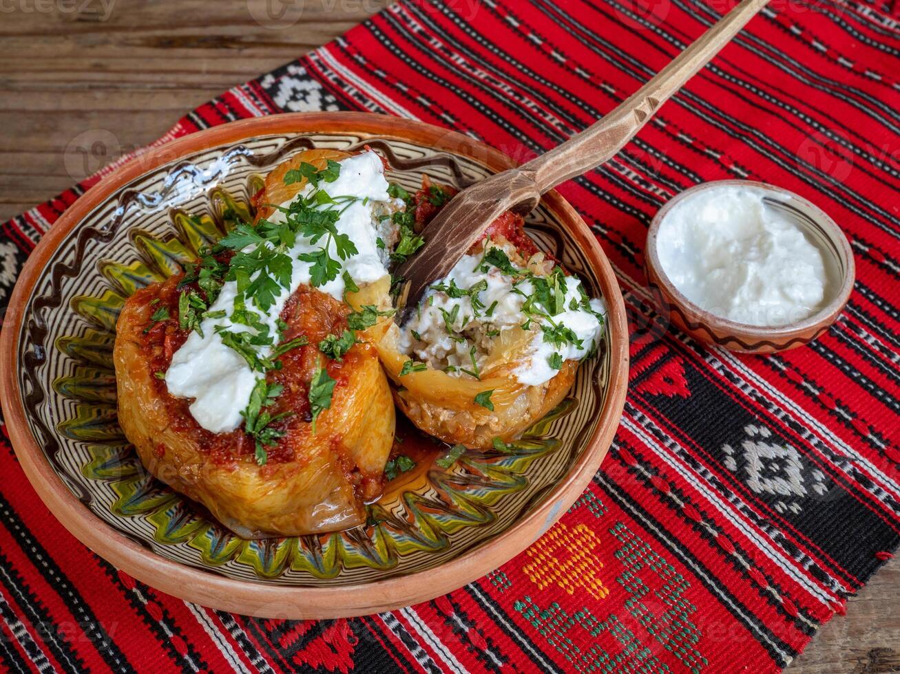 A plate with a bowl of food and a spoon photo