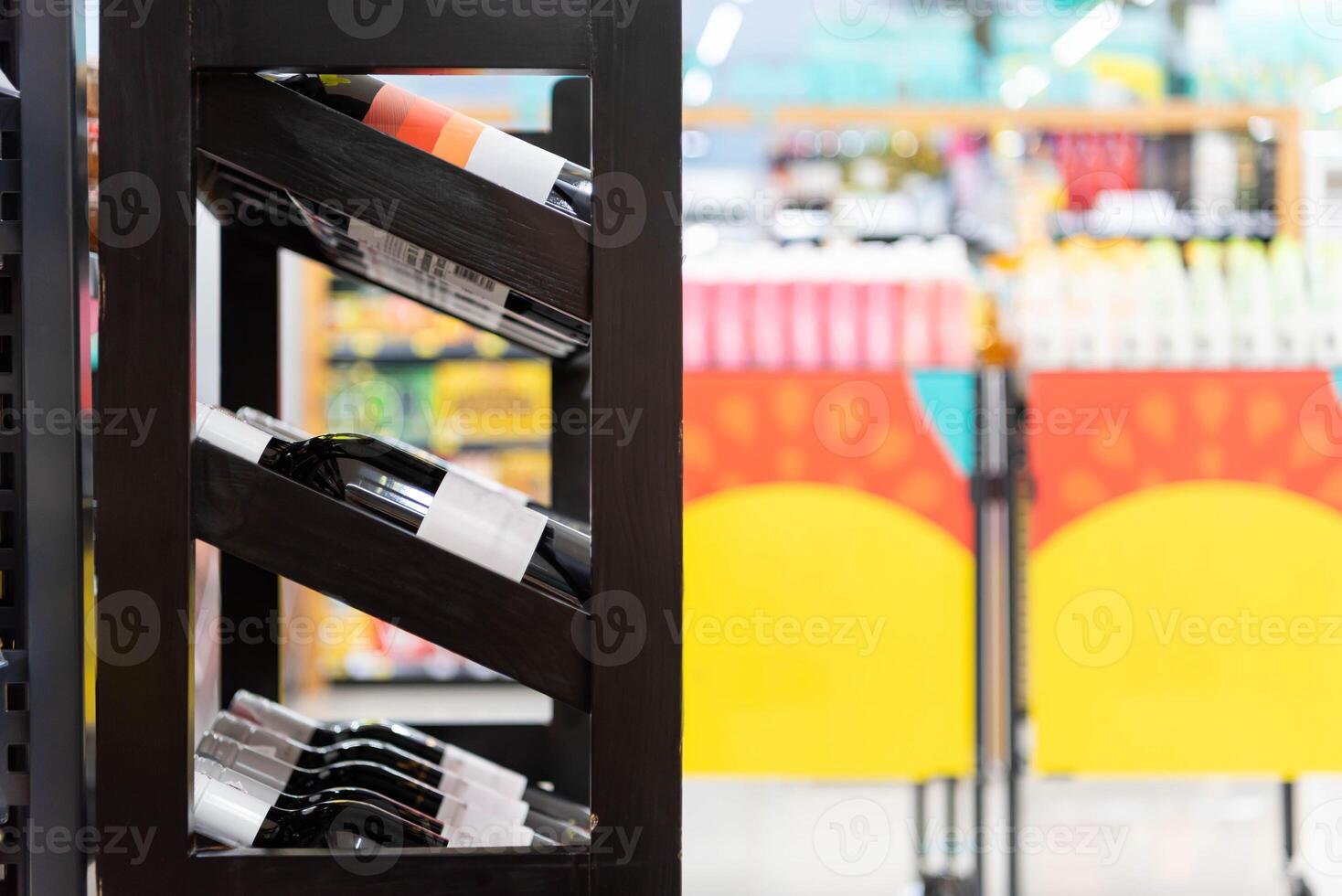 Wine rack in a supermarket with colorful shelves photo