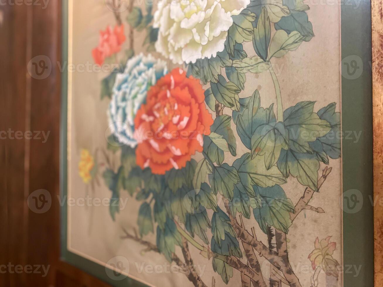 A painting of flowers on a wall in a room photo
