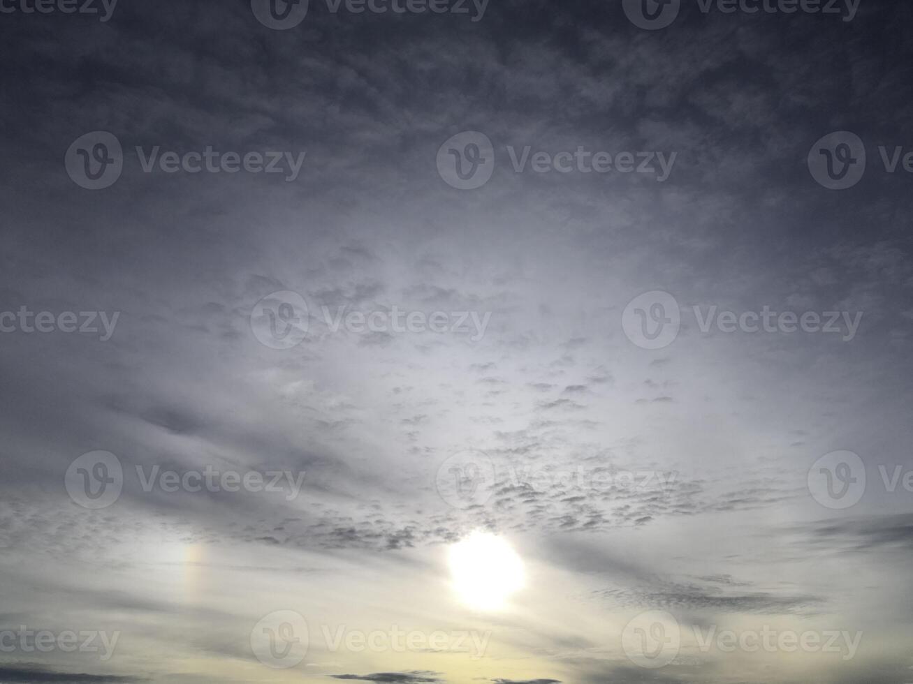 A sunset with a rainbow in the sky photo