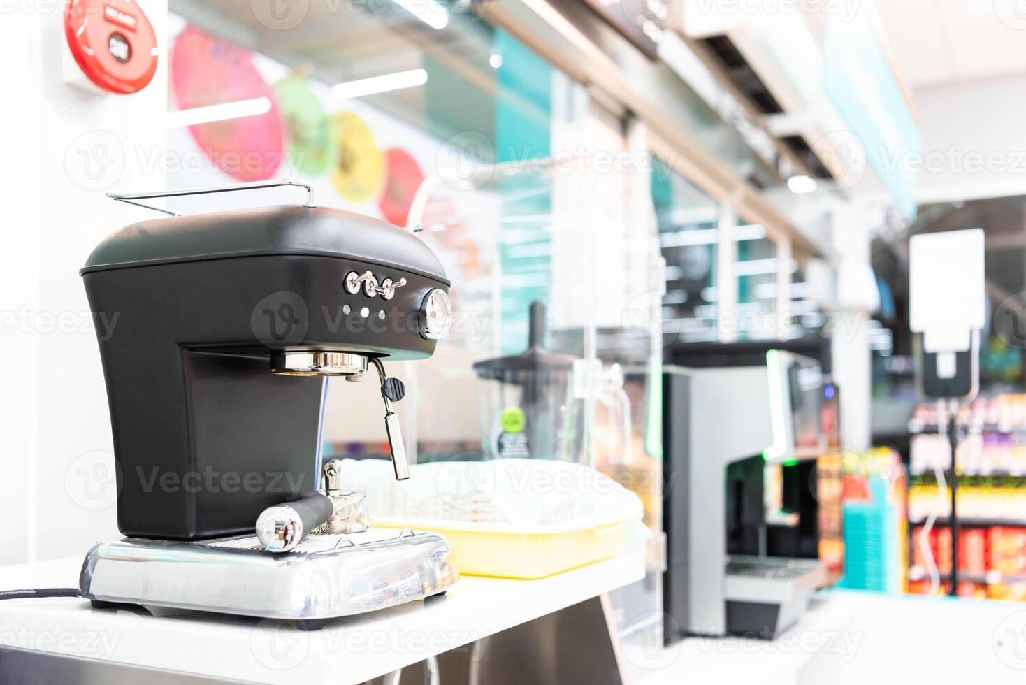 A coffee maker sitting on a counter in a store photo