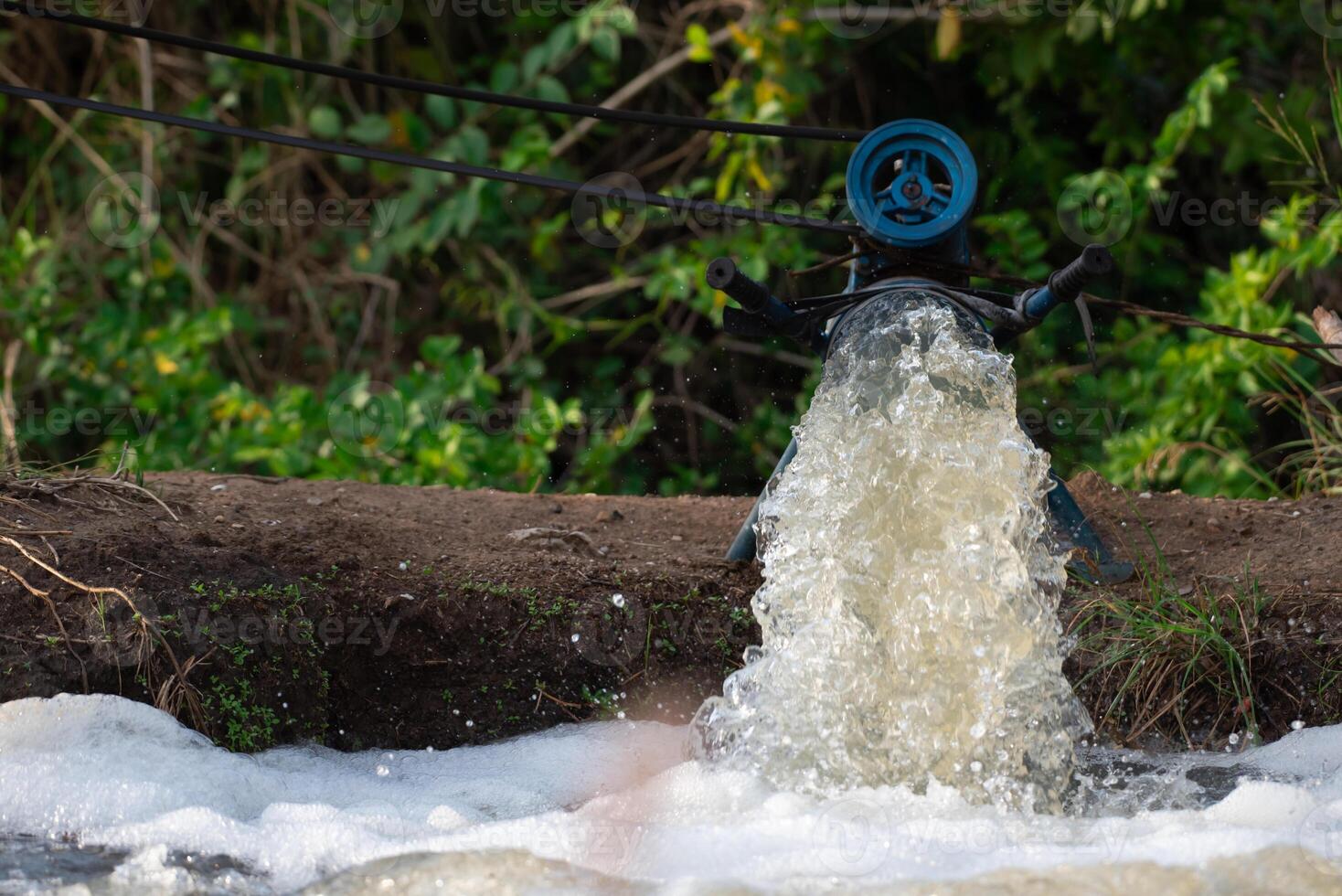 A man standing next to a water pipe photo