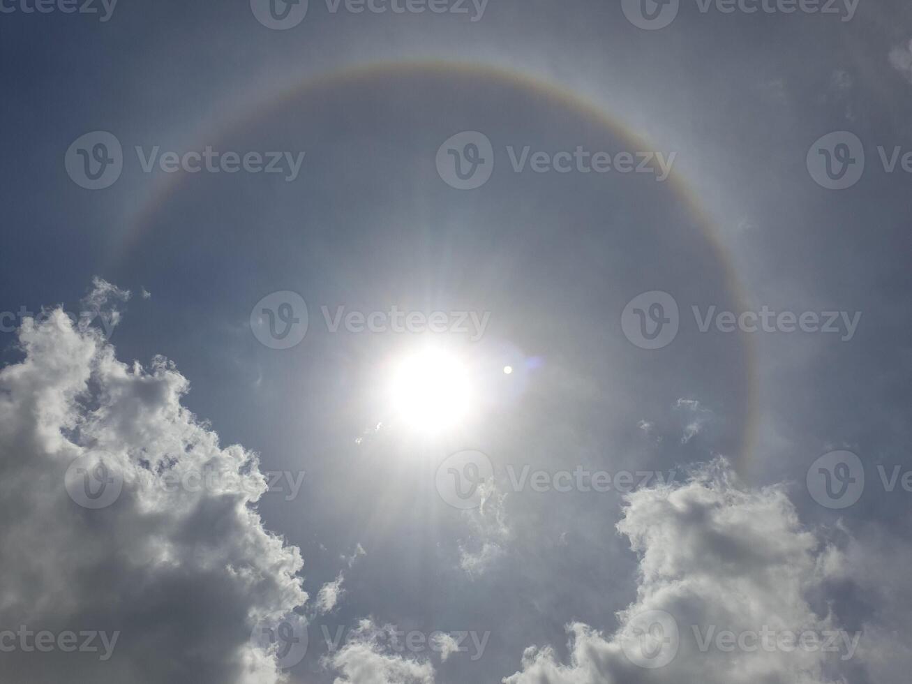 A rainbow halo is seen in the sky photo