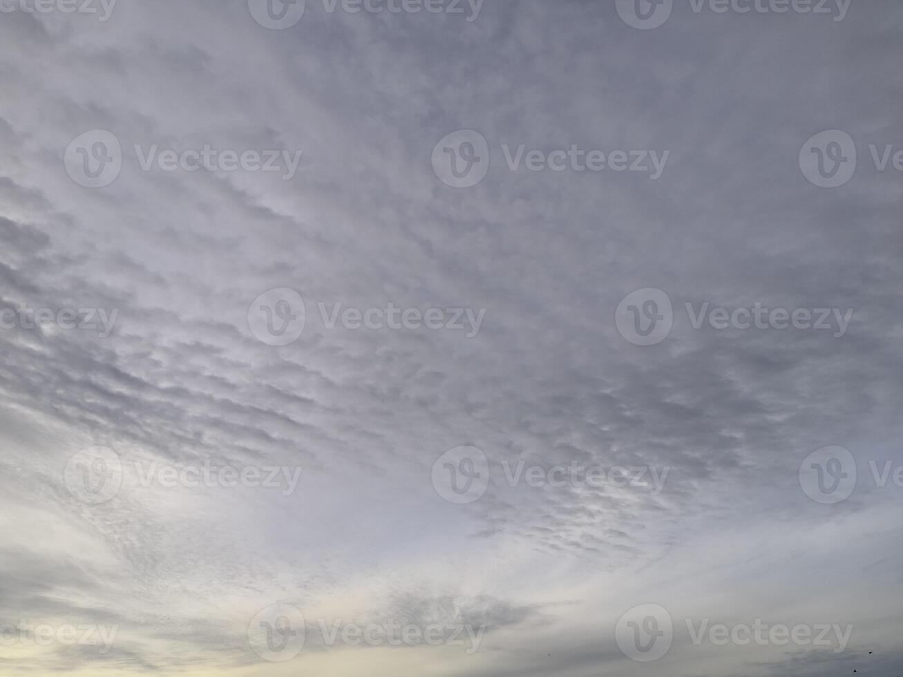 A view of the sky with clouds and a boat photo