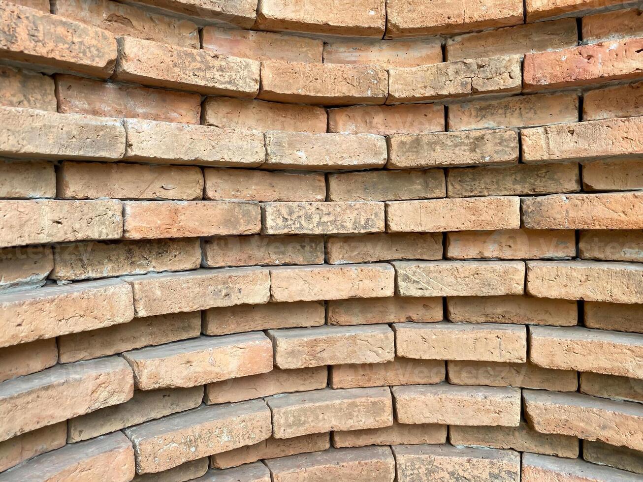 A brick wall with a circular pattern photo