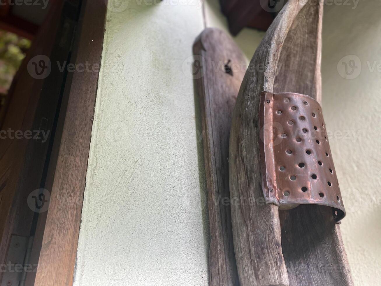 A wooden door with a metal hook on it photo