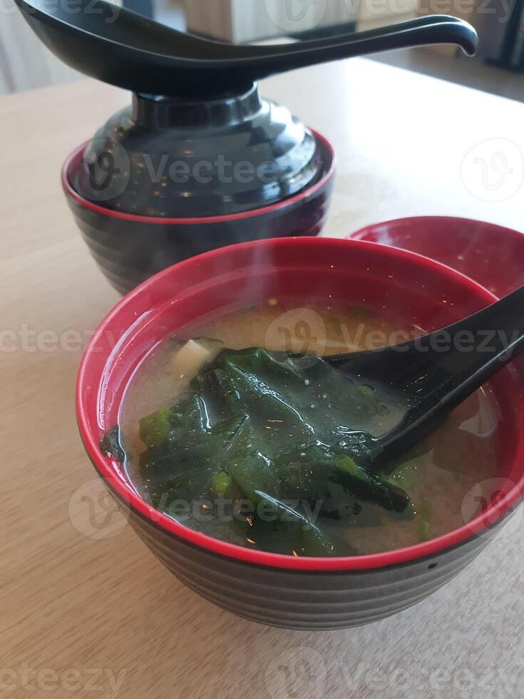 Two bowls of soup on a table photo