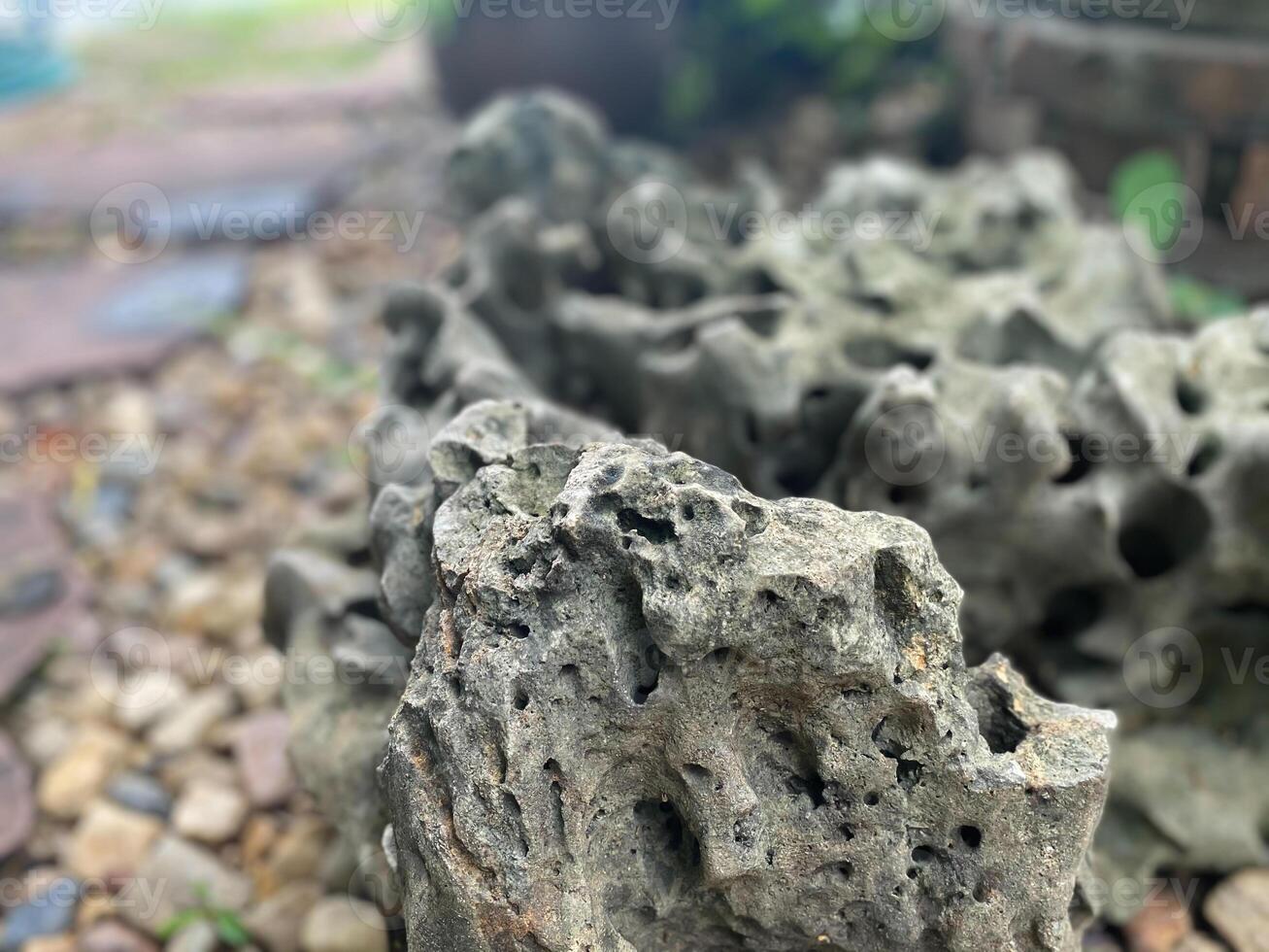 A rock that is sitting on the ground photo