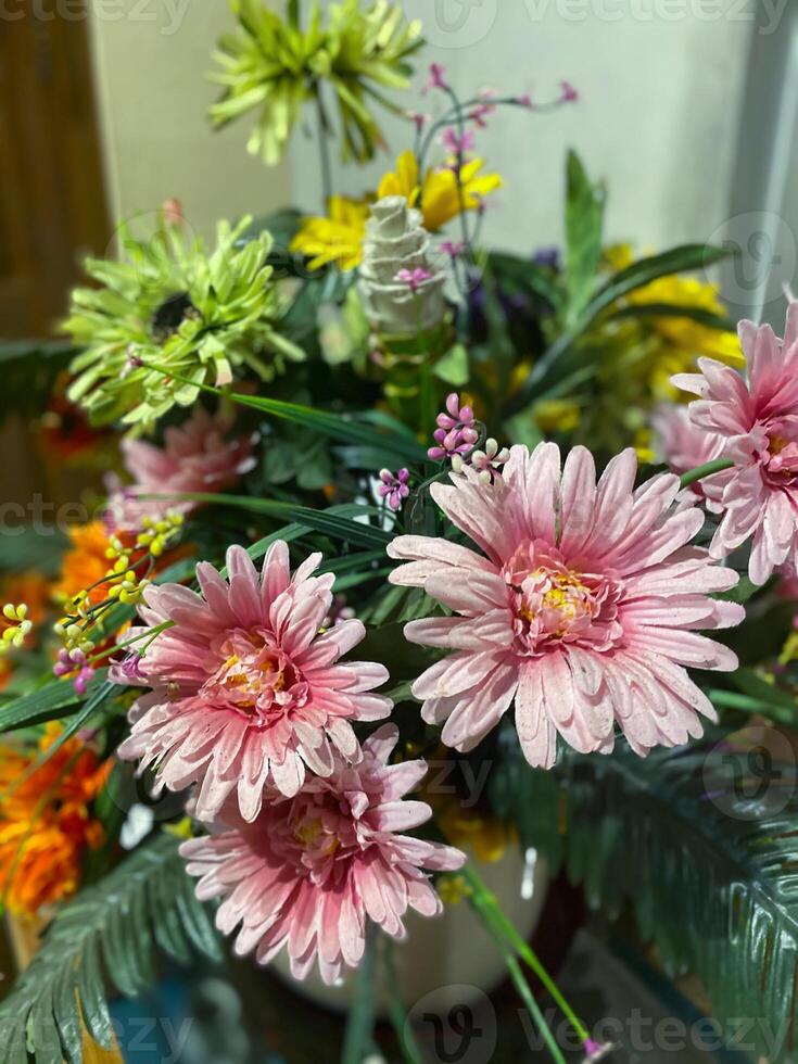 A vase filled with flowers on a table photo