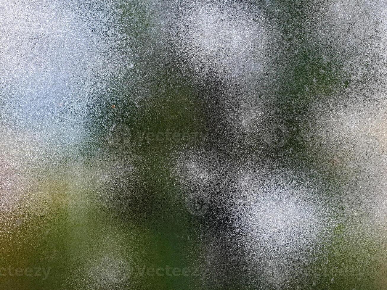 Rainy window with blurred background photo