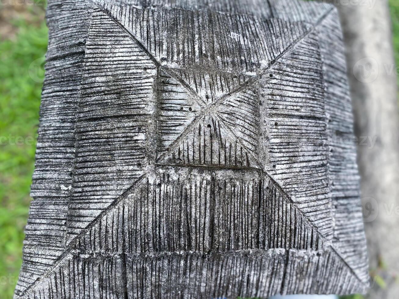A close up of a wooden box with a square pattern photo