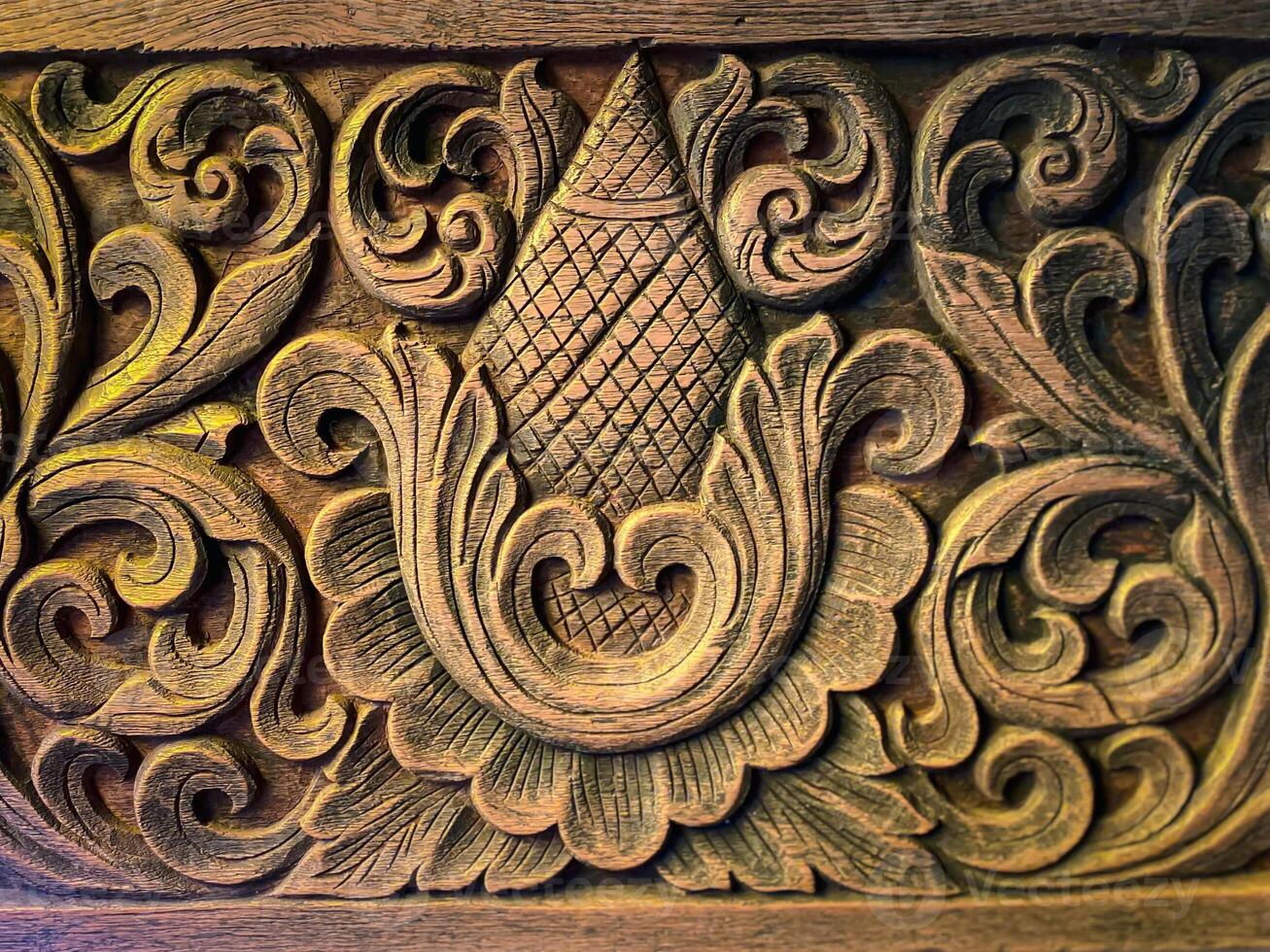 Carved wood panel with floral design photo