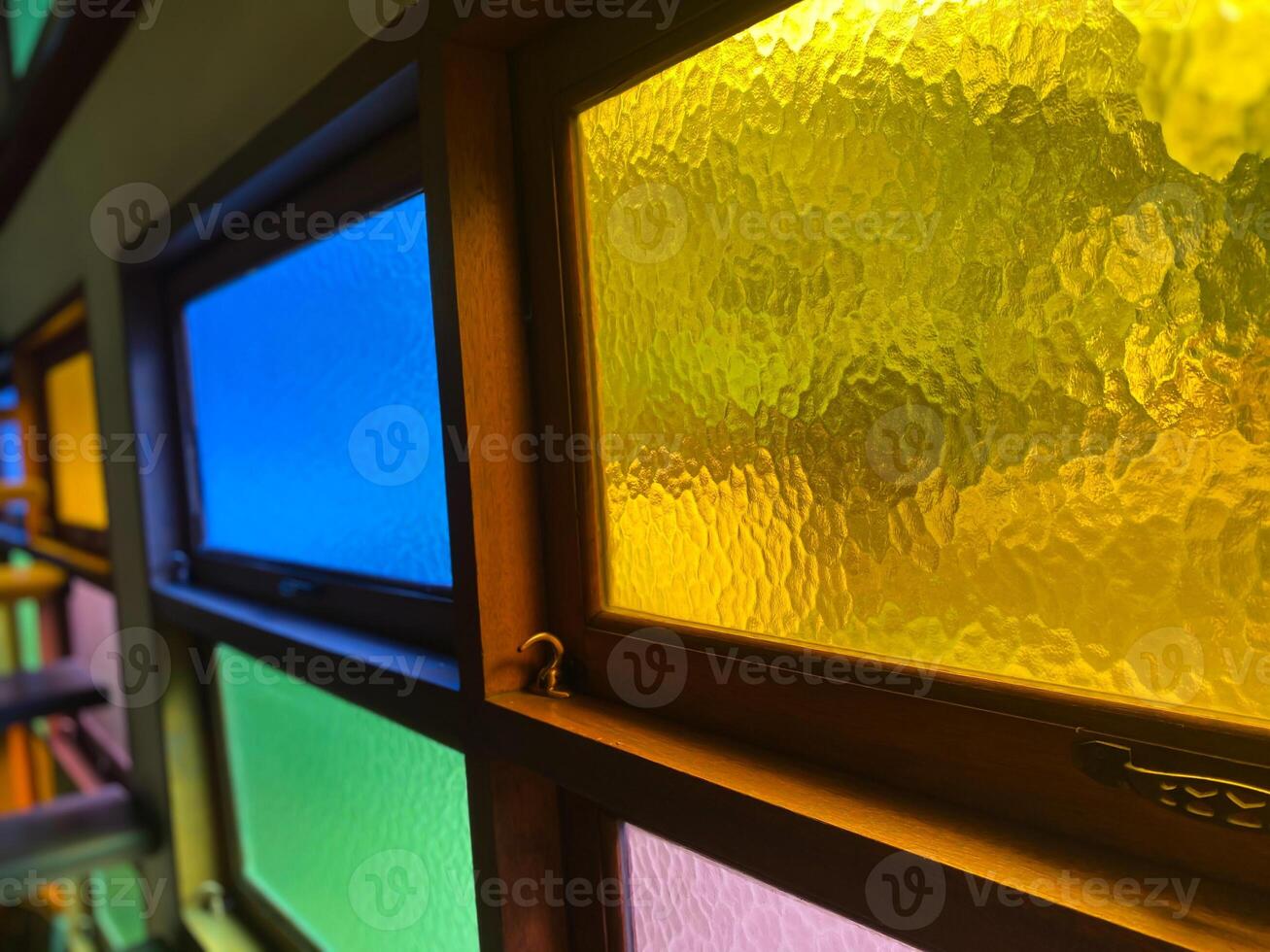 A row of windows with different colored glass photo