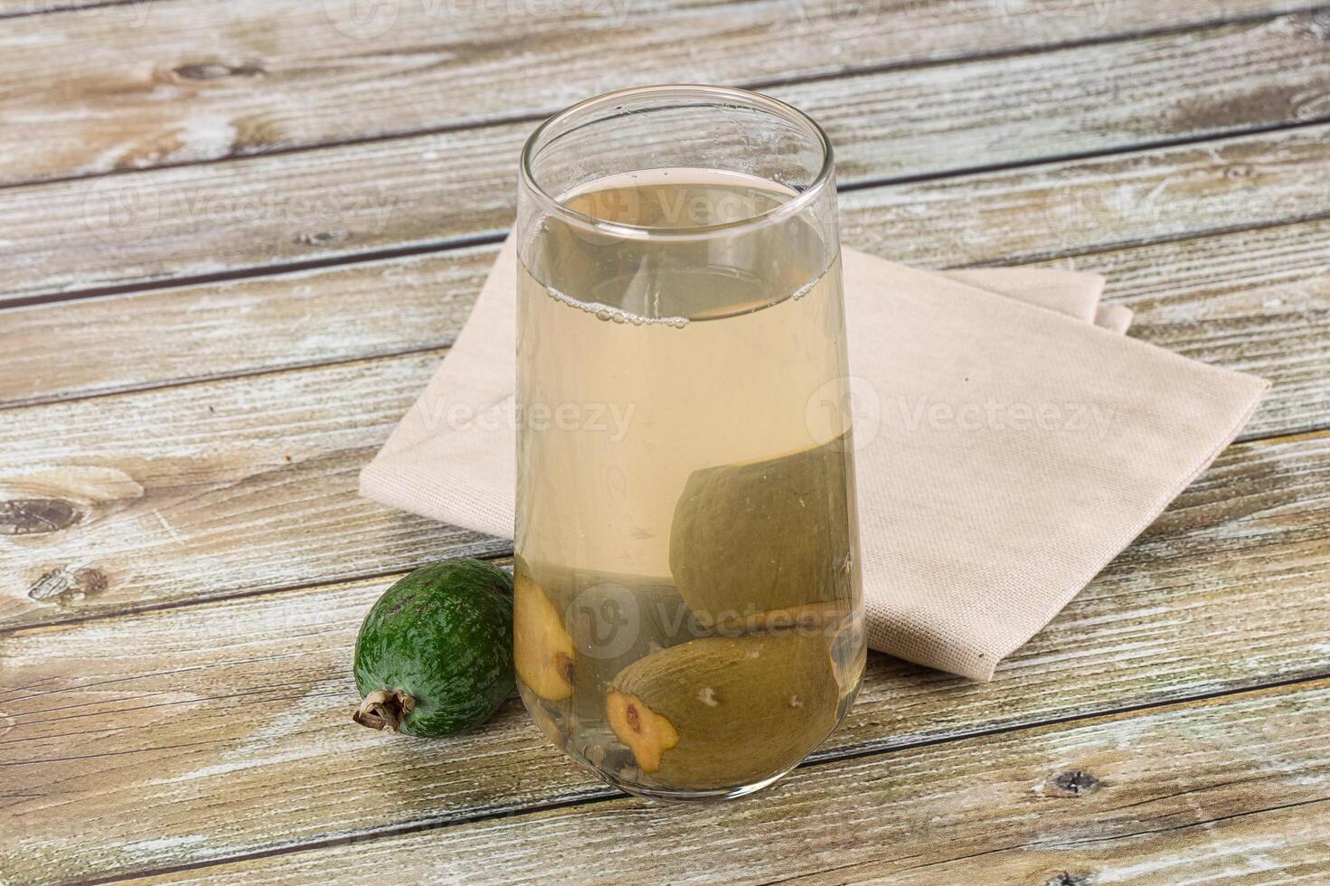A glass of lemonade with a lemon slice in it photo