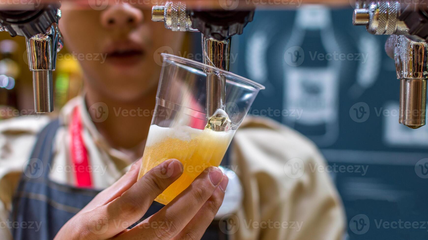 A person holding a glass of beer photo