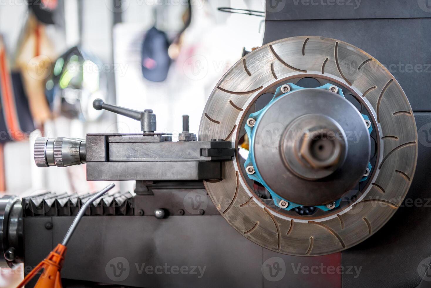 A close up of a brake disc on a machine photo