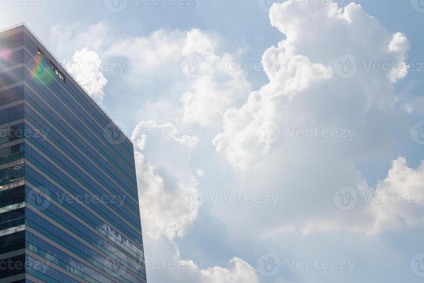 A building with a large window and a sun shining through it photo