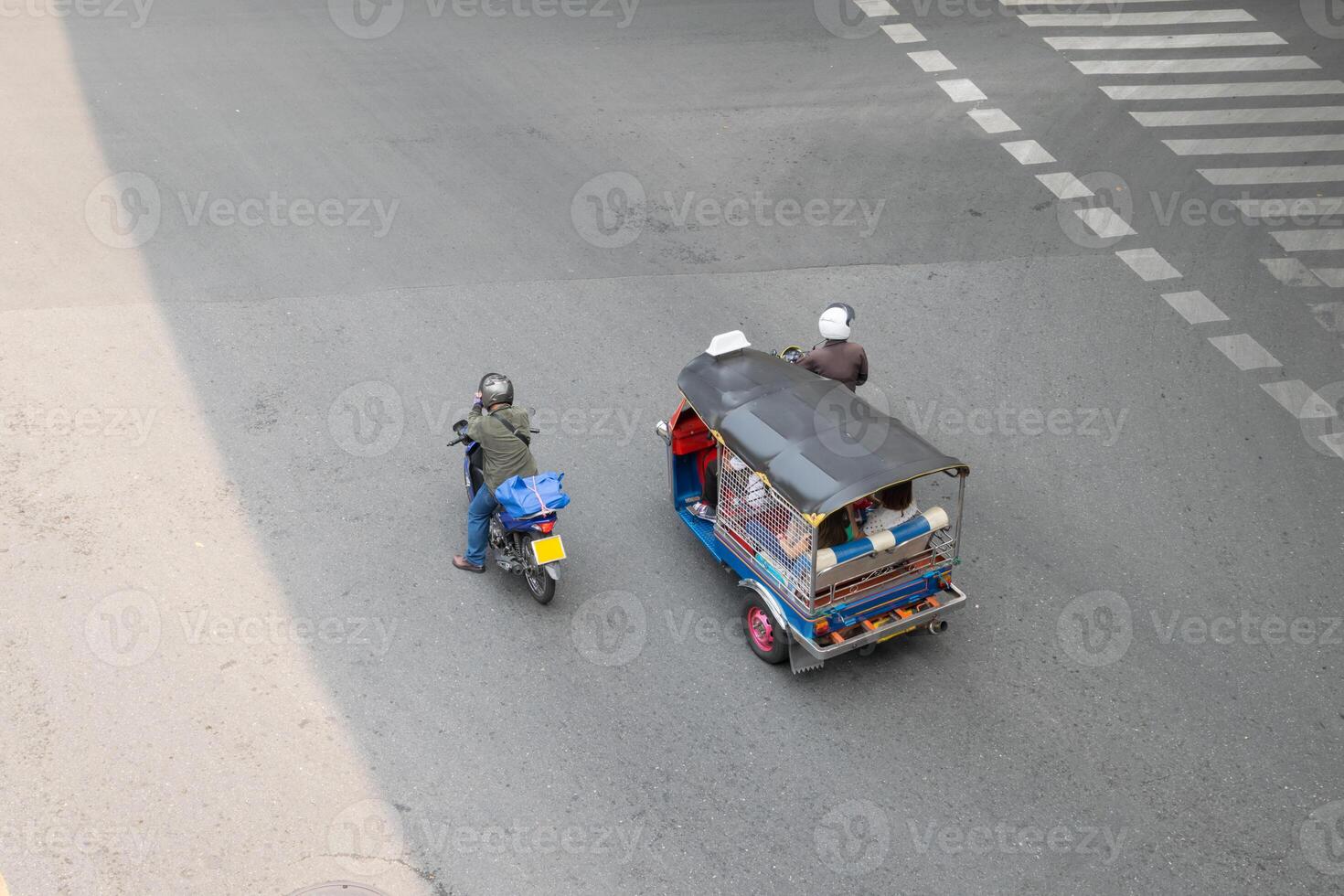 A man and a woman riding a motorcycle photo