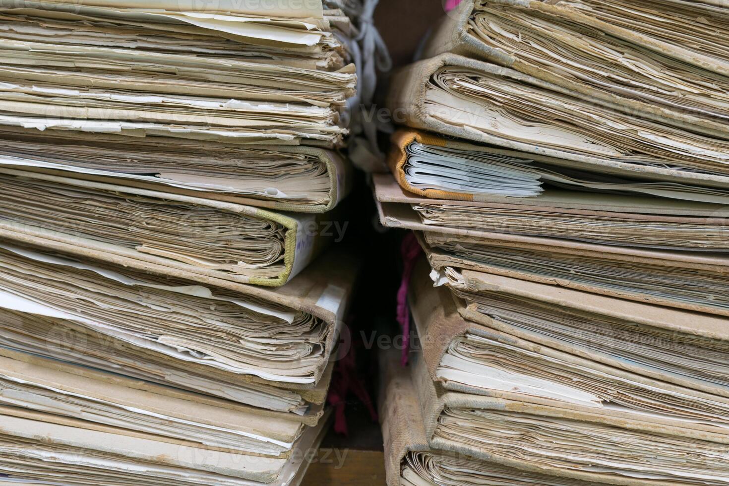 A stack of old documents on a table photo