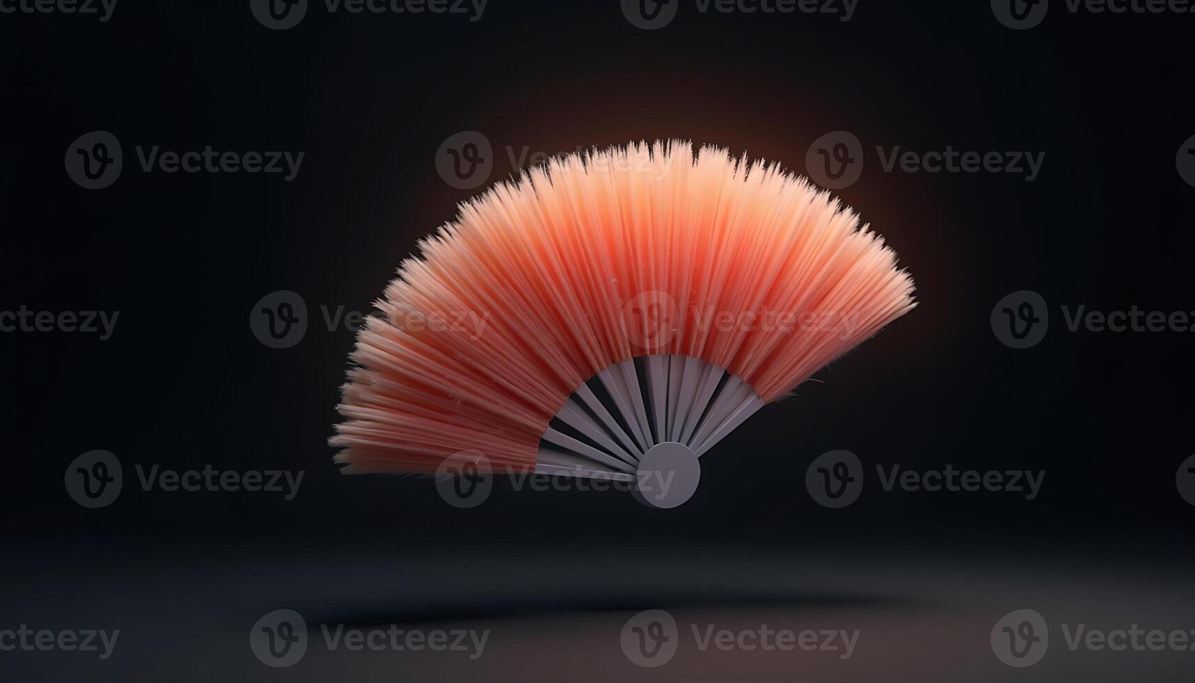 Hand Fan Prop in Peach and Gray Floating on a Dark Backdrop photo